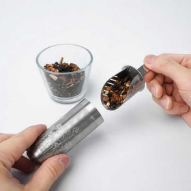 01liv Long-handle Tea Infuser in a mug with a comfortable grip.