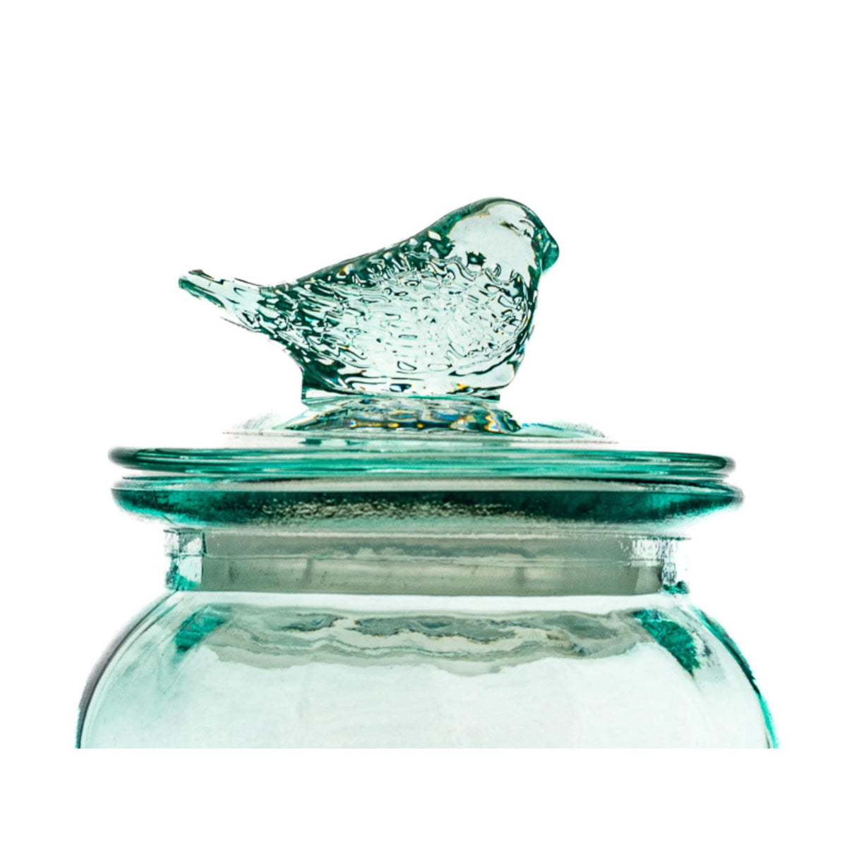 Dimpled blue glass body emphasizes stylish round canister storage.