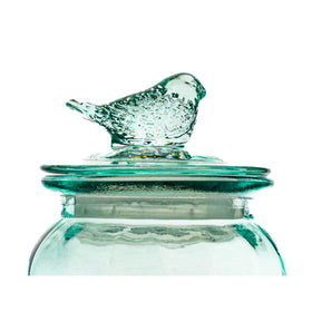 Dimpled blue glass body emphasizes stylish round canister storage.