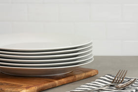 Table setting with 10 Strawberry Street Simply White plates and neutral elegance