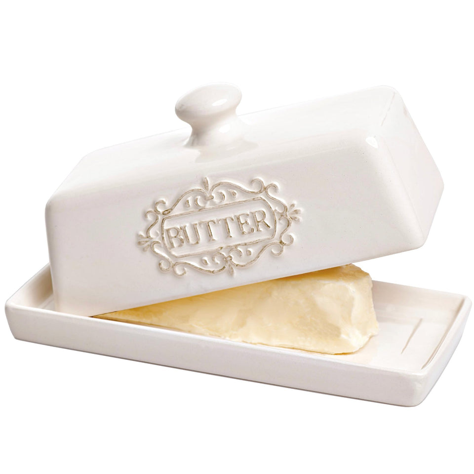 25DOL covered butter dish with lid on countertop, neatly stored sticks