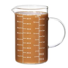 77L glass measuring cup with insulated handle and V-shaped spout for precise pours.