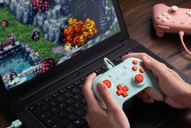 8BitDo Ultimate 2C Mint side angle showing textured grip and responsive triggers.