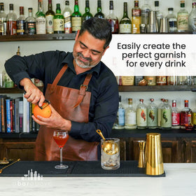 A Bar Above Gold Citrus Peeler in action, peeling citrus without pith waste.