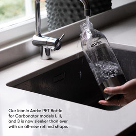 Aarke 1L bottle side profile with stainless steel accents for kitchen style