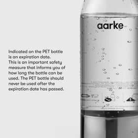 Aarke 1L bottle with stainless accents, premium home bar aesthetic