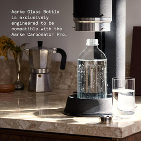 Aarke bottle featuring a stainless steel cap for secure sealing.