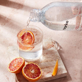 Aarke glass bottle shows beverage level up to the marked line.