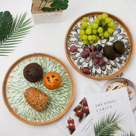 Decorative wicker tray on wooden base adds sophistication to any table.