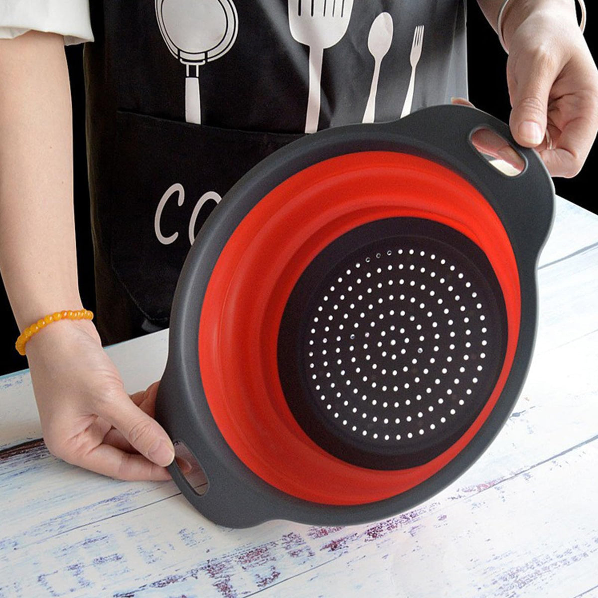 ABSOK colander with non-slip handle for safe lifting of hot foods