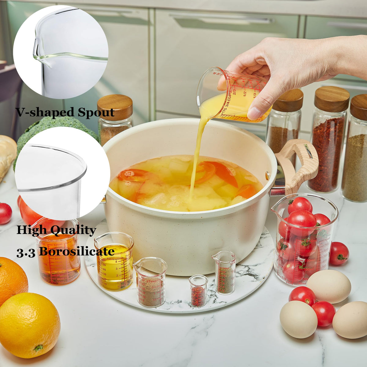 Ackers BORO3.3 glass measuring cups show clear scale markings for ml, oz, and tsp accuracy.