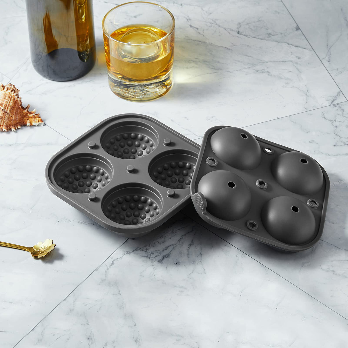 ACOOKEE Golf Ice Tray spheres floating in a drink