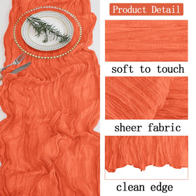 ACSUIT orange cheesecloth table runner with candles and flowers creates warm ambiance.