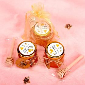 Adabocute baby shower setup with bee-themed favors