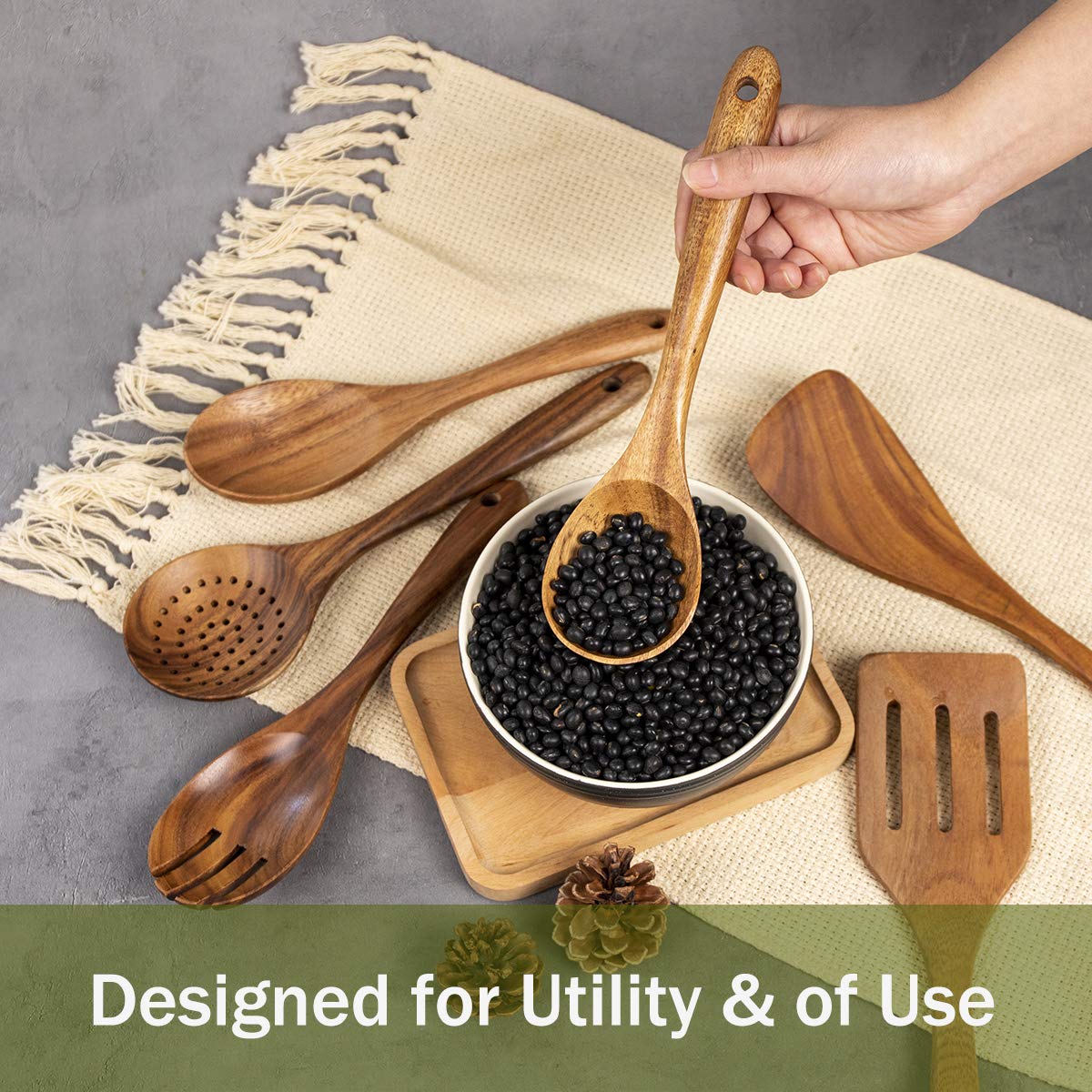 ADT AIUHI spoon close-up on a kitchen counter with smooth wood.