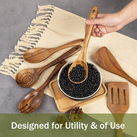 ADT AIUHI spoon close-up on a kitchen counter with smooth wood.