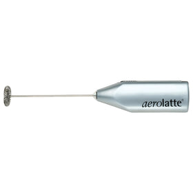 Aerolatte milk frother in action creates silky foam on coffee.