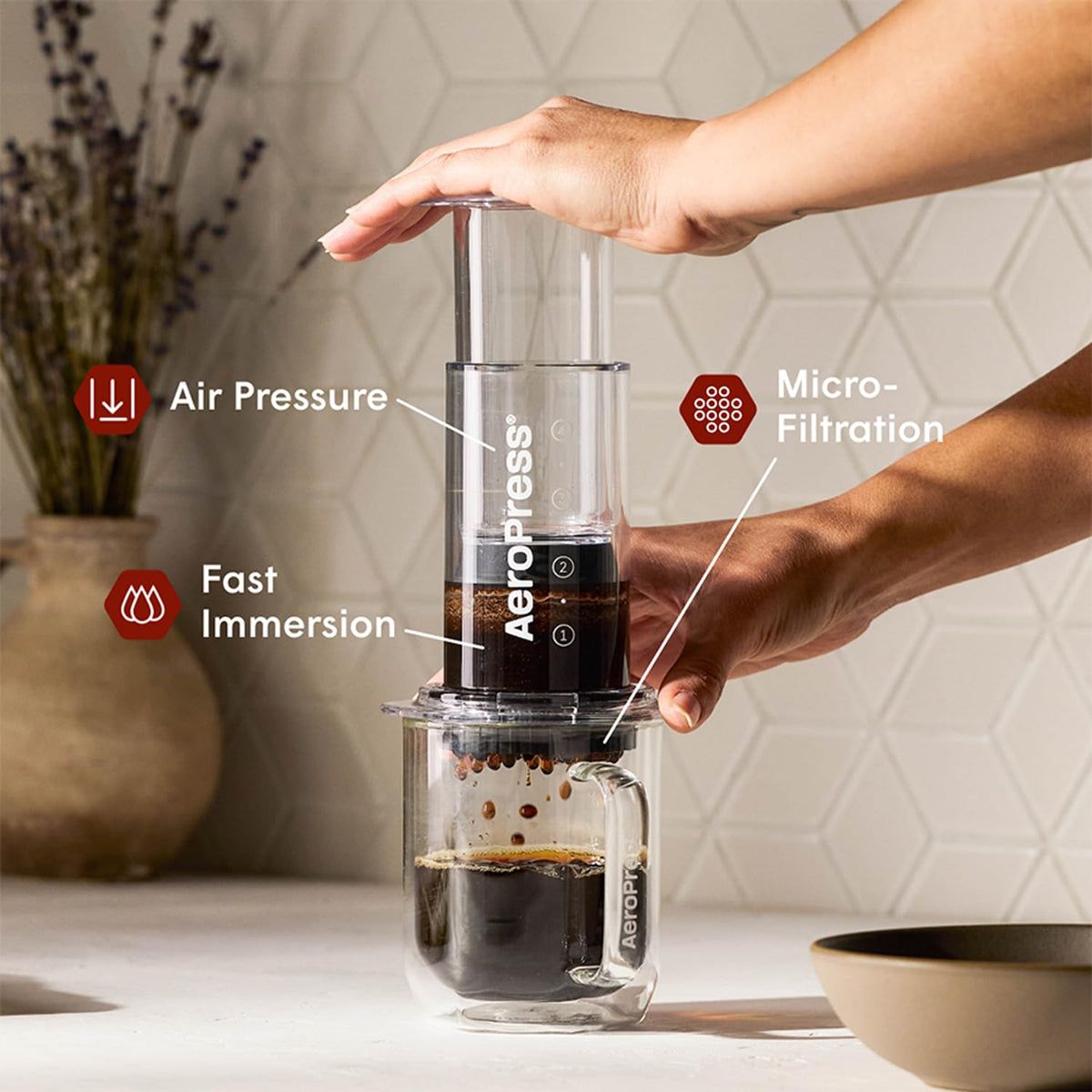AeroPress brewed coffee in a clear cup highlighting grit-free extraction.