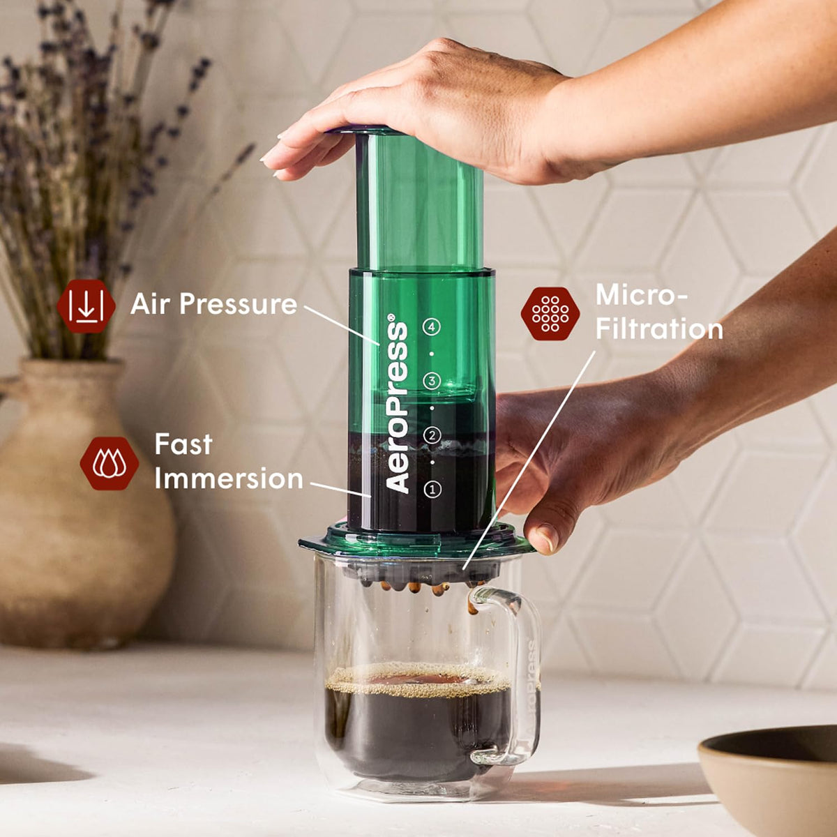AeroPress Clear Green Coffee Press 3-in-1 technology for French press, pour-over, and espresso-style drinks.