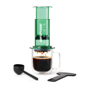 AeroPress Clear Green Coffee Press overview: portable, shatterproof brewer with visible brew progress.