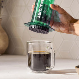AeroPress Clear Green portable design ready for travel and camping adventures.