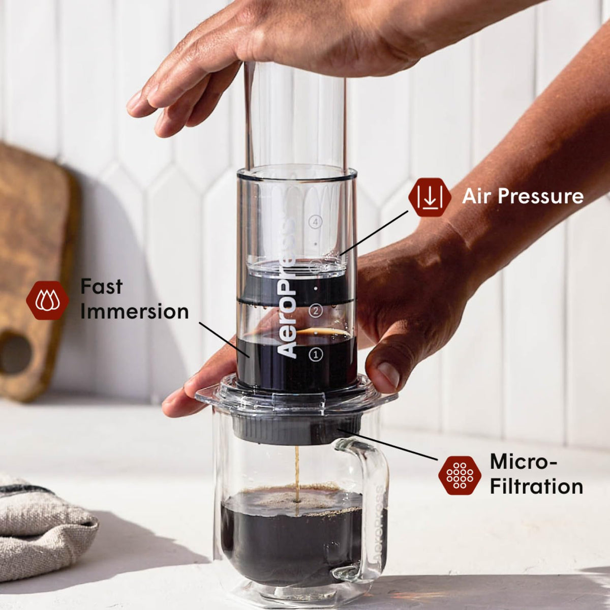 AeroPress Flow Control Cap in action during a brew, highlighting complete control over grind size and time.
