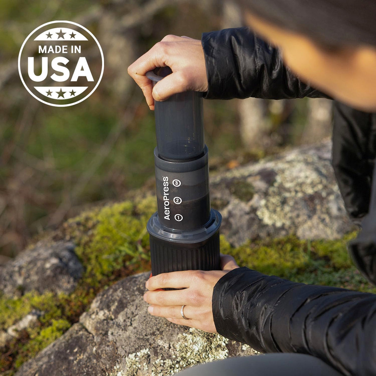 AeroPress Go camping scene captures reliable performance on hikes and trips.