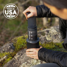 AeroPress Go camping scene captures reliable performance on hikes and trips.