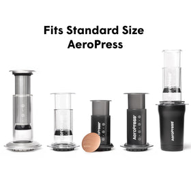 AeroPress eco friendly filter shown with mug for travel.