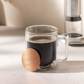AeroPress Gold Tone filter showing durable titanium coating.