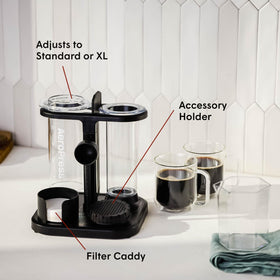 AeroPress Organizer Stand side view highlights dedicated slots for coffee maker, scoop, and filters.