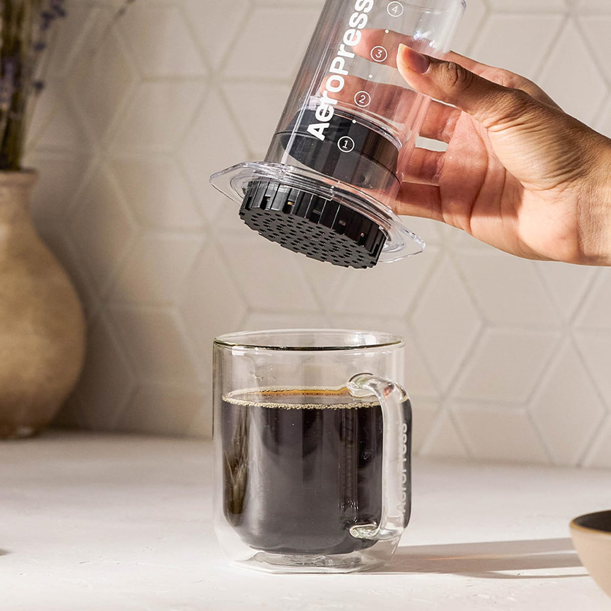AeroPress travel kit compact in a backpack for on-the-go brewing.