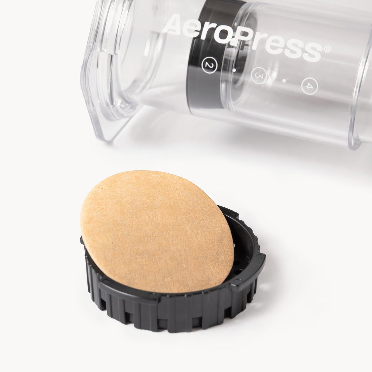 AeroPress unbleached compostable filters closeup showing micro-filtration.