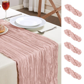 AGIRL dusty pink cheesecloth table runner on a long banquet table, adding romantic charm.