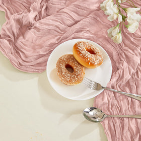 AGIRL dusty pink table runner paired with candles for an intimate celebration vibe.