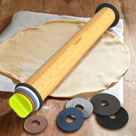 Rolling pizza dough with Aguegro to create an even, professional crust.