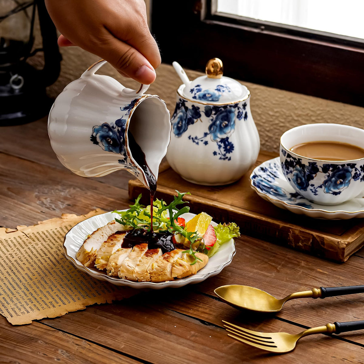 Agyiuns coffee and tea serving set in white with blue flower accents.