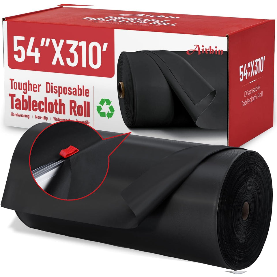 Airbin black tablecloth roll unrolled on dining table provides a sleek, protective surface.