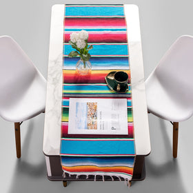 Airooglee cotton table runner with sewn edges protects surfaces during gatherings.