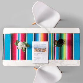 Airooglee fiesta table decoration with vibrant stripes for Cinco de Mayo celebrations.