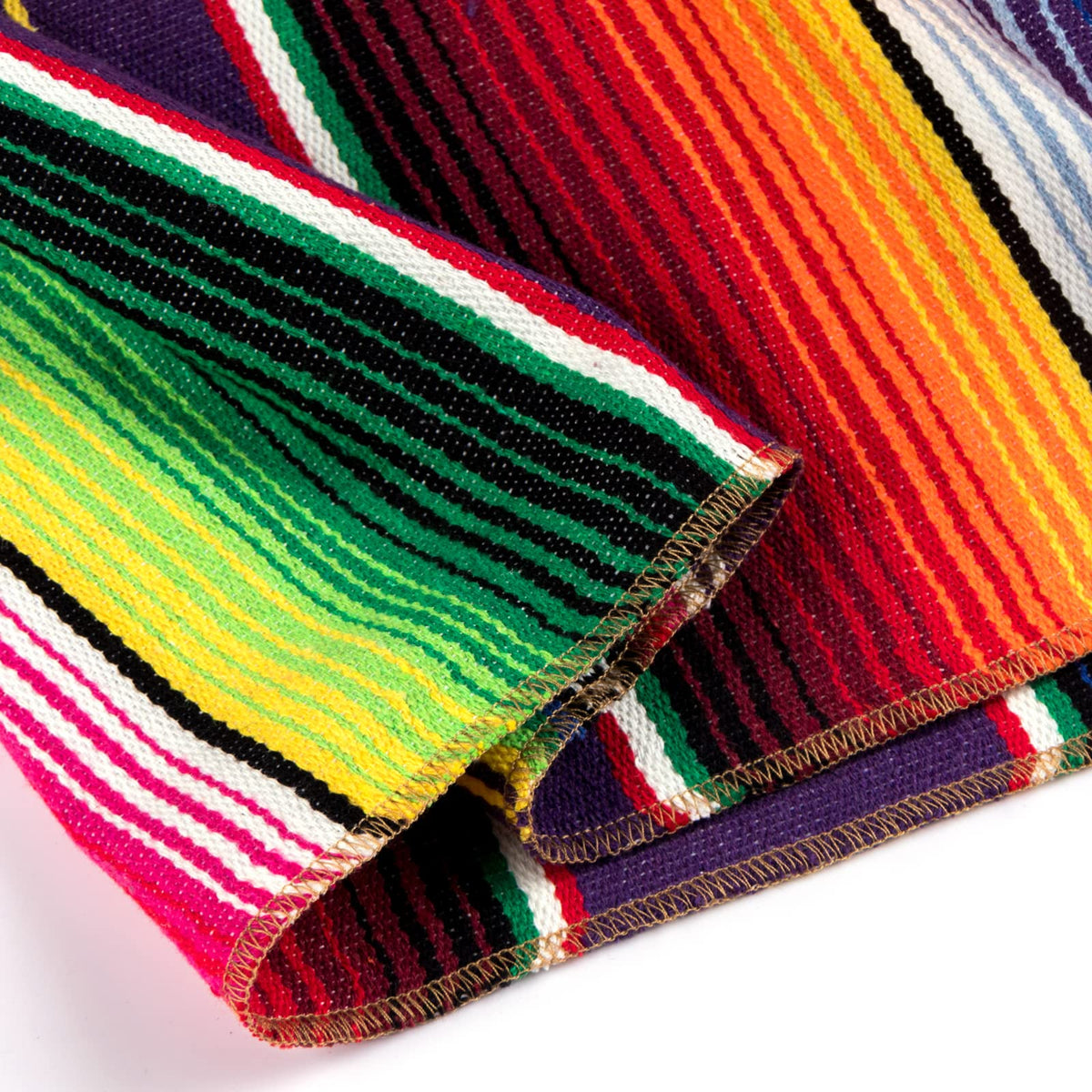 Airooglee serape-striped runner complements rustic or modern dining setups.
