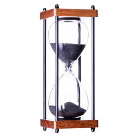 AKAKA MUNING decorative wooden sandglass closeup showing fine sand flow.