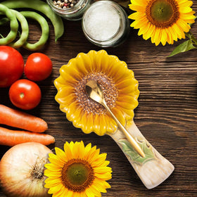 Alarrar sunflower spoon rest on kitchen counter, convenient utensil resting.