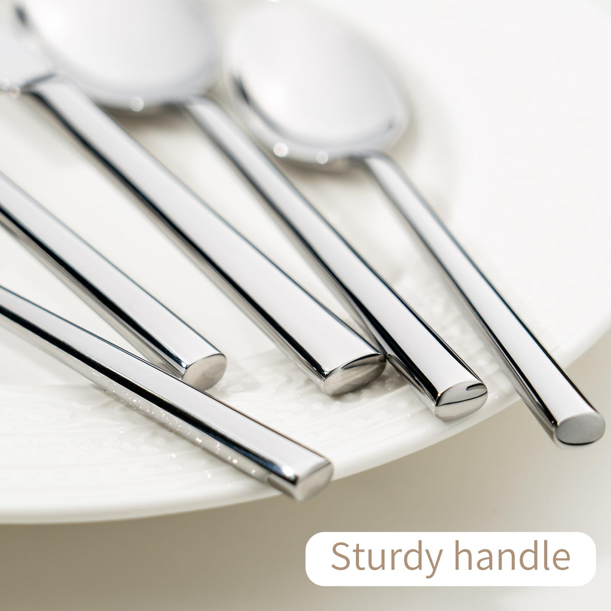 Alata Potter mirror finish silverware for a polished table presentation.