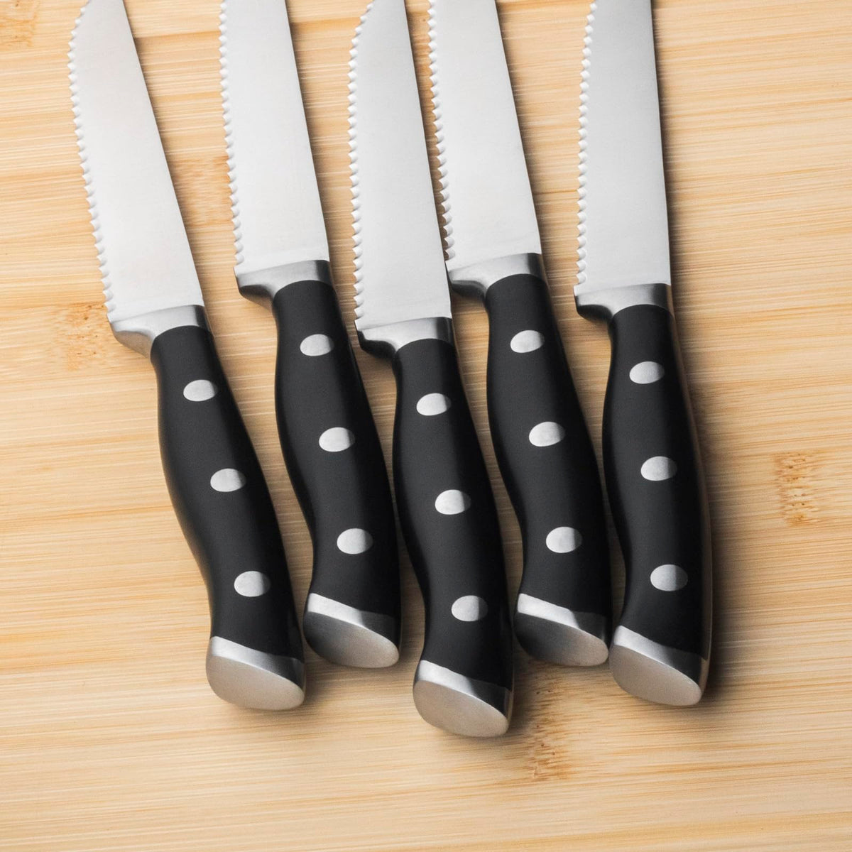 Alata steak knife with full-tang construction offers balanced control.