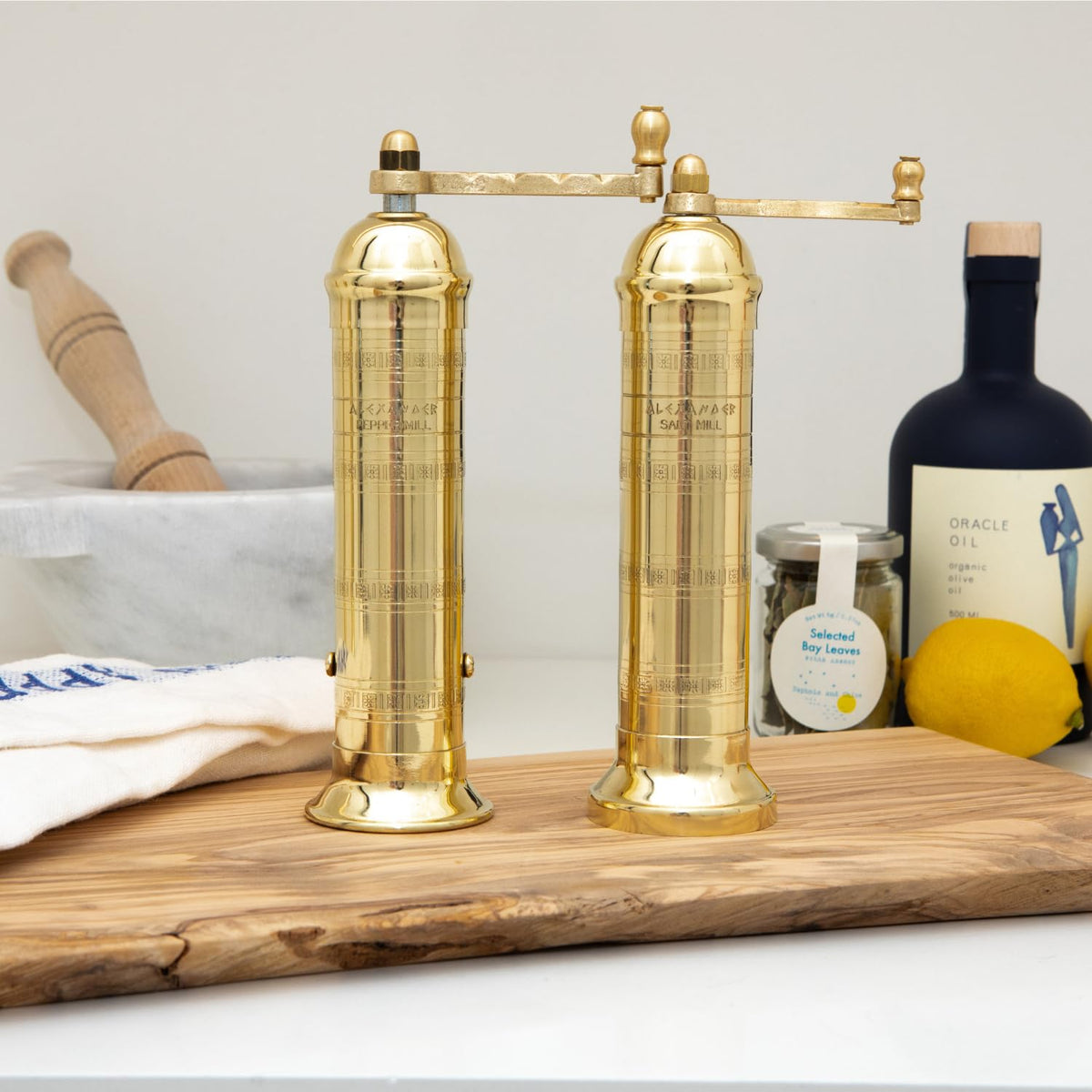 Alexander Home brass mill shows adjustable grind size from fine to coarse.