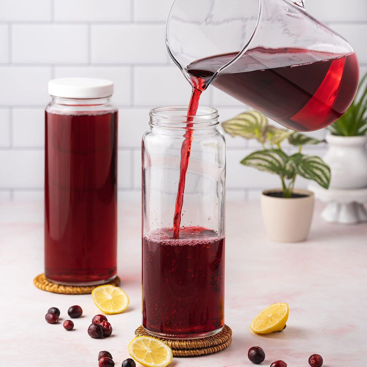 All About Juicing glass bottles with silicone-lined lids keep drinks fresh and spill-free.