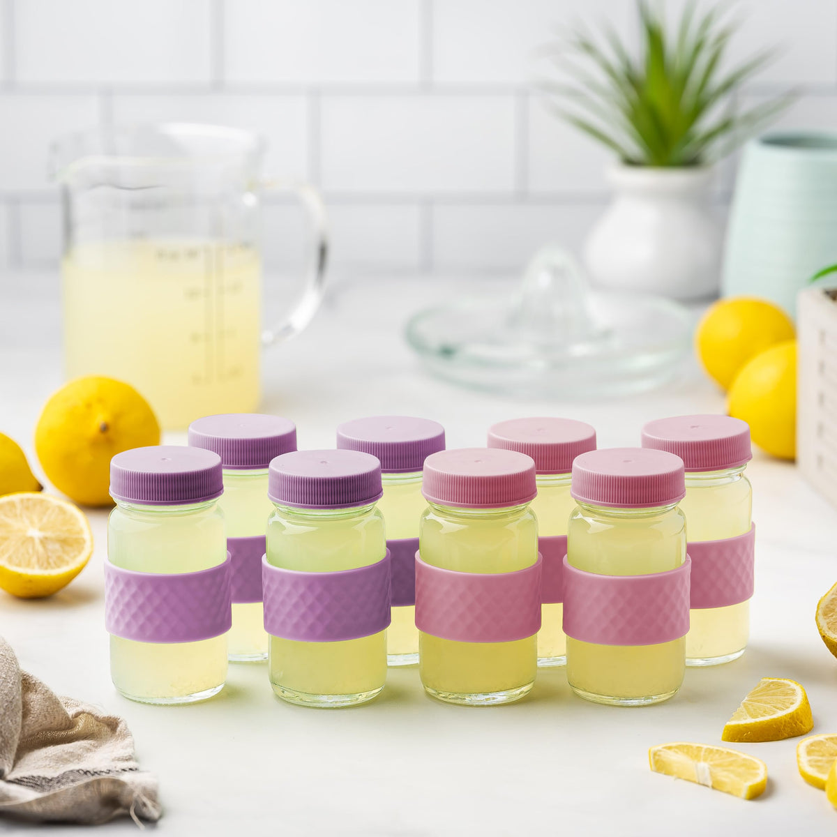 All About Juicing silicone grip band bottle offers secure hold during travel.