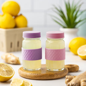 All About Juicing turmeric and ginger shot bottle for flavorful daily shots.