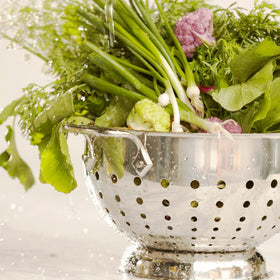 All-Clad colander dishwasher-safe with pedestal base ensures stable cleaning and draining.
